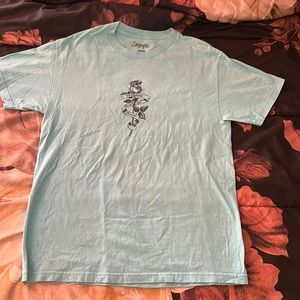 A sky blue empyre shirt with tattoo like graphics